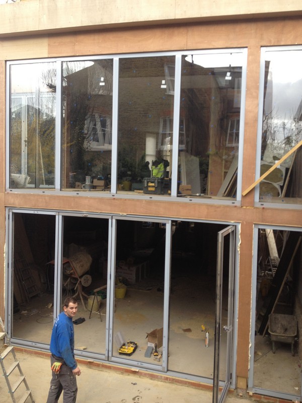 Aluminium bi-fold doors with two-storey glazing in Tulse Hill