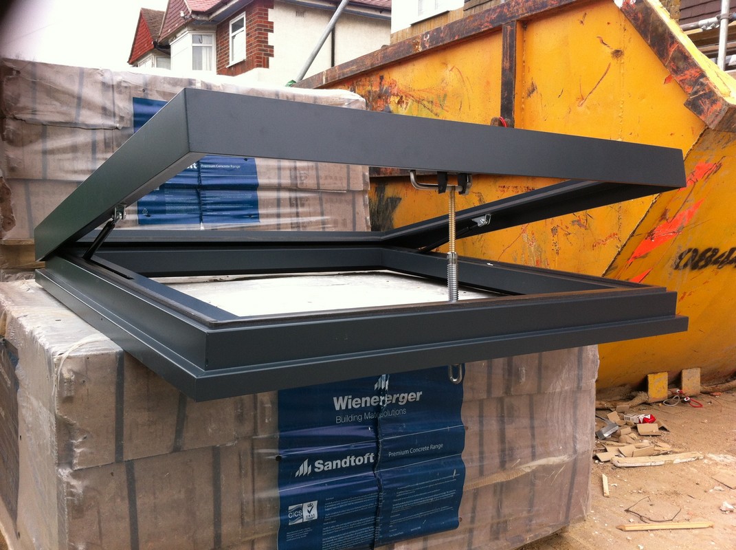 Opening flat roof skylight in anthracite grey installed in Tulse Hill